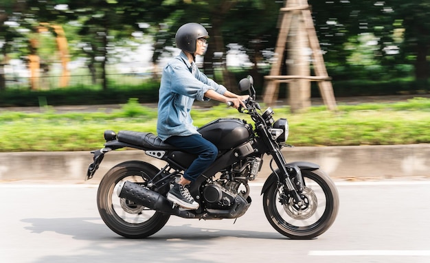 Image of Asian man driving on the street