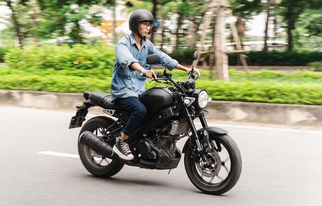 Image of Asian man driving on the street