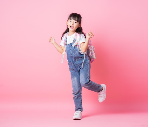 Image of Asian primary school student on pink background