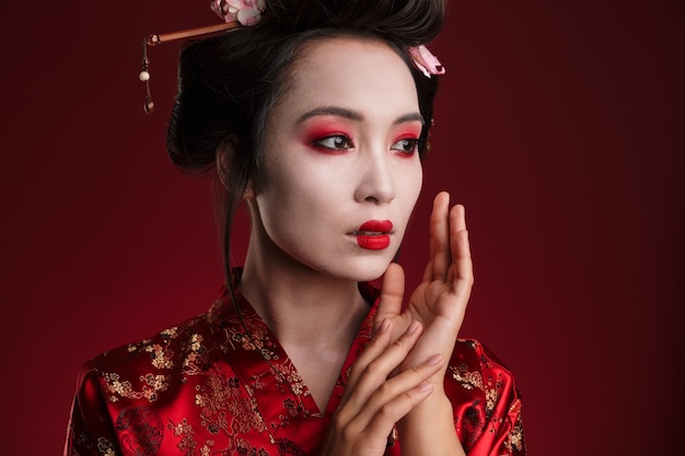 Image of attractive asian geisha woman in traditional japanese kimono