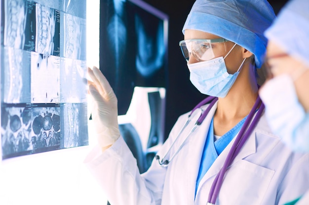 Image of attractive woman doctor looking at xray results