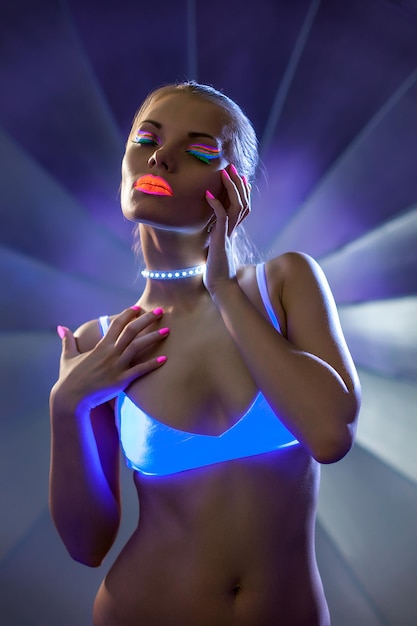 Image of beautiful slim girl with glowing makeup