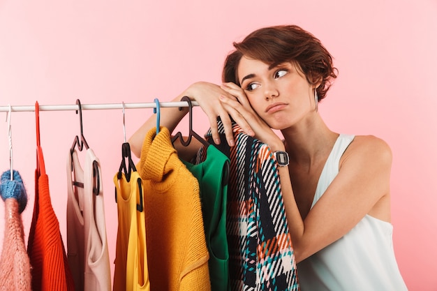 Image of a beautiful thoughtful woman stylist posing isolated 