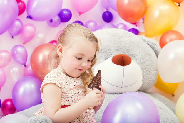 Image of beautiful young girl playing in game room