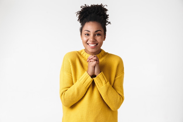 Image of a beautiful young happy excited emotional woman posing over white wall.