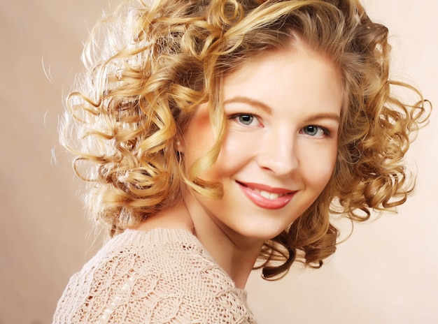 Image of beautiful young woman with curly hair