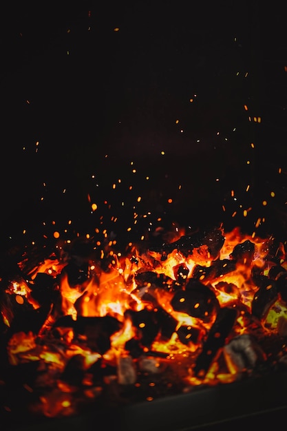 Image of burning coals in a restaurant grill