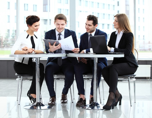 Image of business partners discussing documents and ideas at meeting