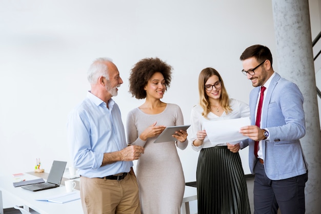 Image of business partners discussing documents and ideas