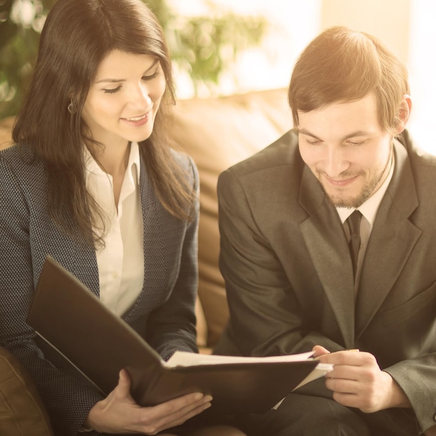 Image of business people listening and talking to their colleague at meeting