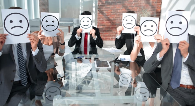 Photo image of businessman holding drawing of upset face