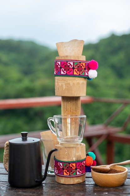 Image of a coffee machine with fresh coffee beans background and made from bamboo.