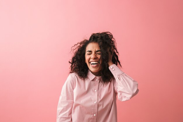 Image of emotional young african woman posing isolated dressed in pajama.