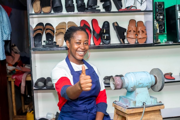 image of Excited african woman doing a yes sign with foot wearworkshop concept