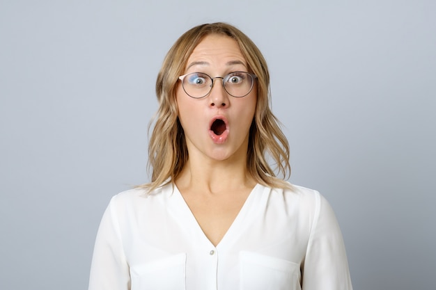 Image of excited young woman isolated