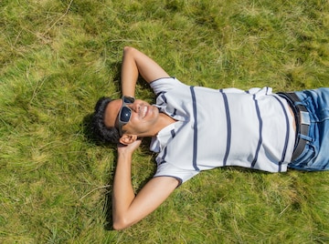 Teen Guy in Sunglasses is Sitting on the Grass in Nature in a Shirt and  Jeans Stock Image - Image of grass, handsome: 231383091