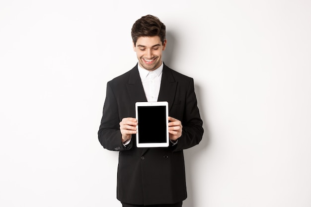 Image of good-looking male entrepreneur in black suit