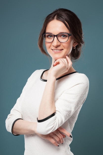 Image of good looking woman in light clothes standing 