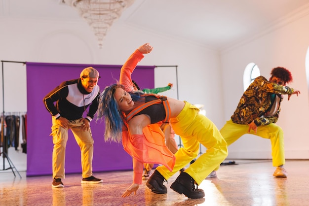 Image of group of group of diverse female and male hip hop dancers taking part in photo shot. Dance, rhythm, movement and training concept.