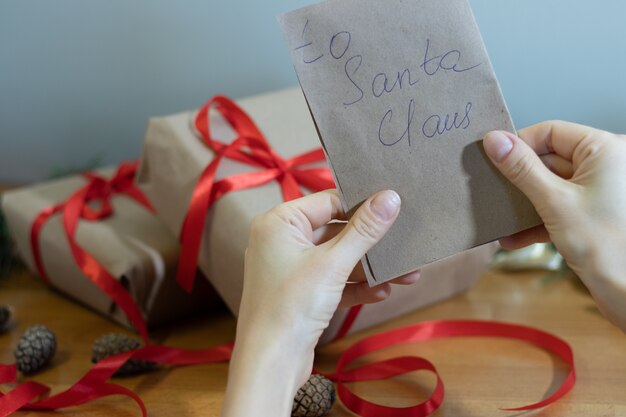 Photo image of the hands that make handmade gifts for christmas. high quality photo