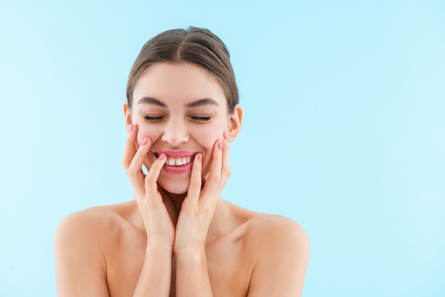 Image of happy cheerful beautiful young woman posing isolated.