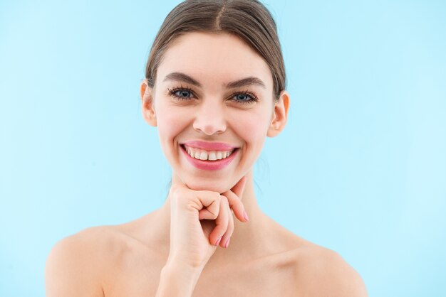 Image of happy cheerful beautiful young woman posing isolated.