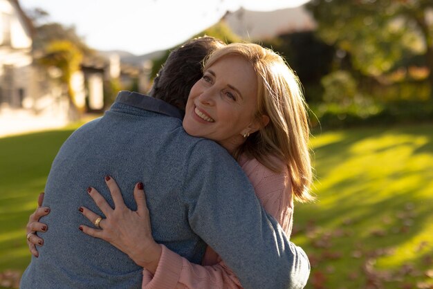 Photo image of happy senior caucasian couple embracing in garden. family and spending quality time together concept.