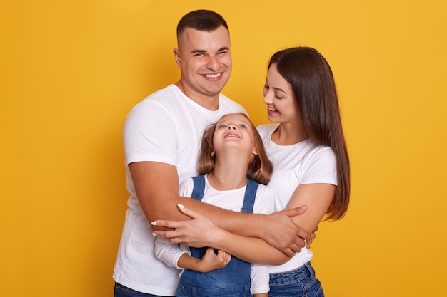 Image of happy young caucasian Family in studio.