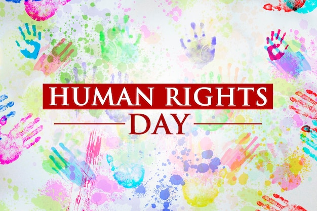 Image of Human Rights Day text with colorful people handprints background