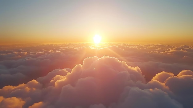 The image is a beautiful sunset over a sea of clouds The warm colors of the sunset and the soft pillowy clouds create a peaceful and serene scene