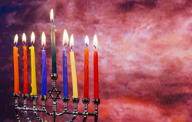 Image of jewish holiday Hanukkah background with menorah traditional candelabra and Burning candles