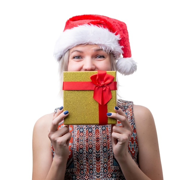 Image of joyful woman in santas cap with gift on face