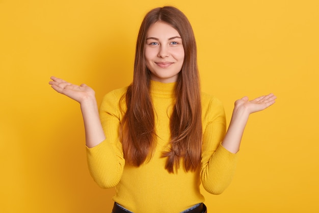 Image of lady with charming smile spreading hands aside