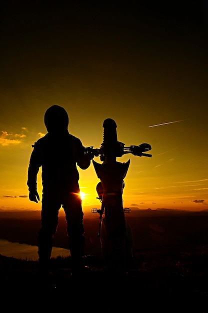 An image of a motorcyclist doing a stunt and jumping in the air.