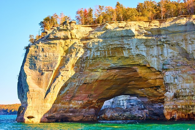 Image of Pictured rocks with tunnel through the stone that looks painted