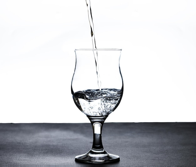 The image of pouring drinking water into a glass