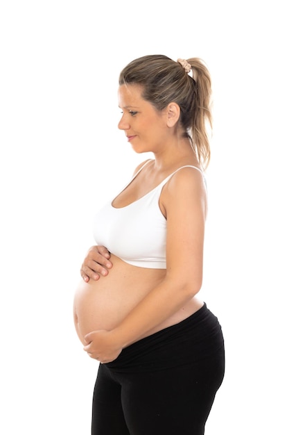 Image of pregnant woman touching her belly with hands