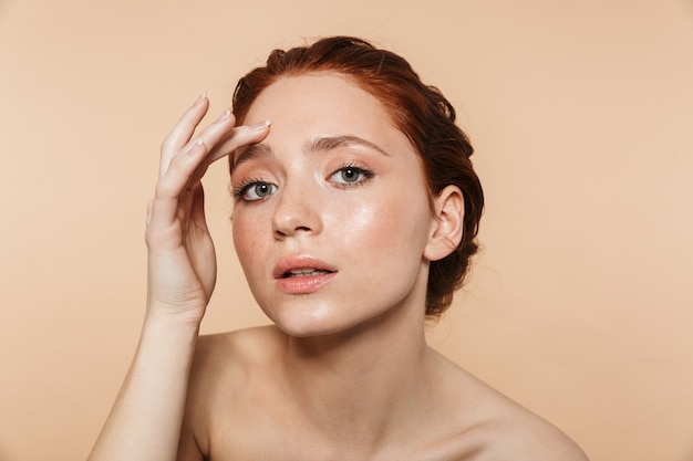 Image of a pretty young redhead woman posing isolated