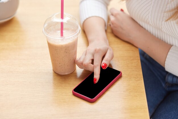 Image of red phone laying on table