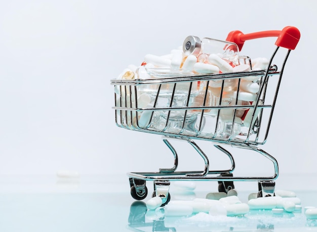 Image of a shopping cart with medicines photo with a copyspace