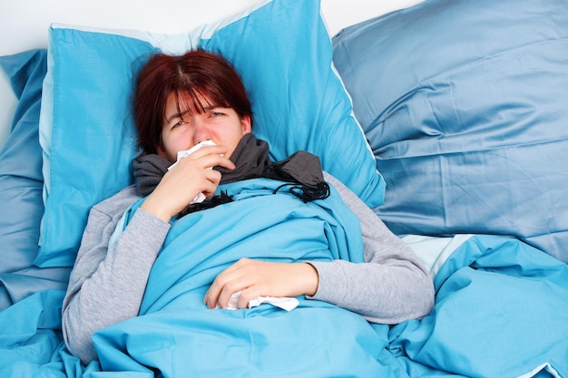 Image of sick woman lying on bed