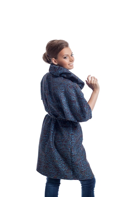 Image of smiling woman posing in fashionable coat