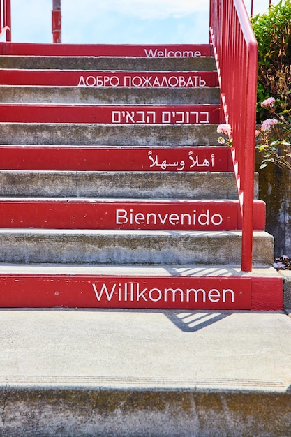 Photo image of steps of welcoming at golden gate bridge in different languages