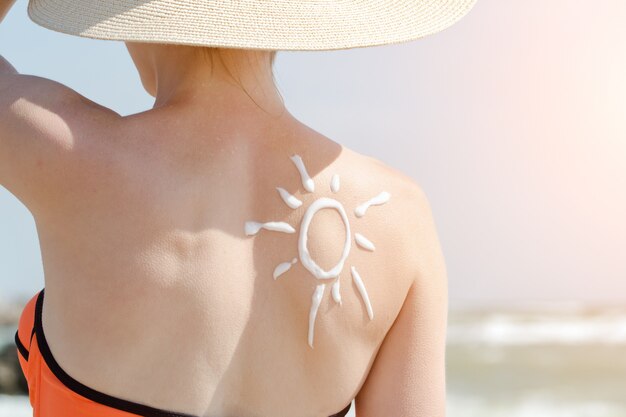 Photo image of the sun on the back of a girl