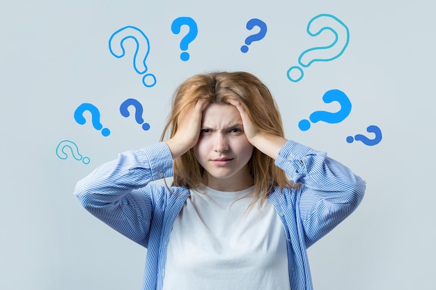 image of a thinking young girl looking camera have an idea stands on a white background