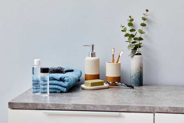 Image of toilet table with toiletries towel and cosmetic for face care in bathroom