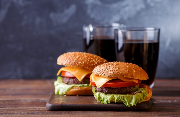 Image of two fresh hamburgers and two glasses of juice