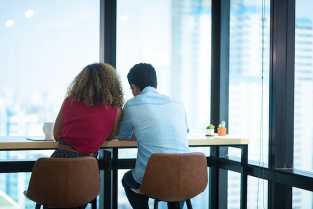 Image of two young businessmen at meeting