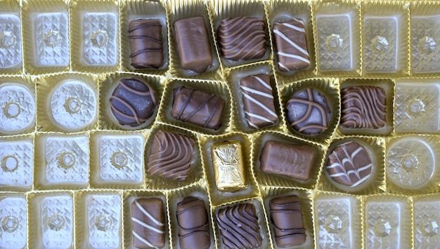 Photo image of a various chocolate bonbons sweet foodtop view