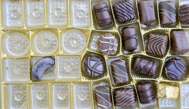 Photo image of a various chocolate bonbons sweet foodtop view